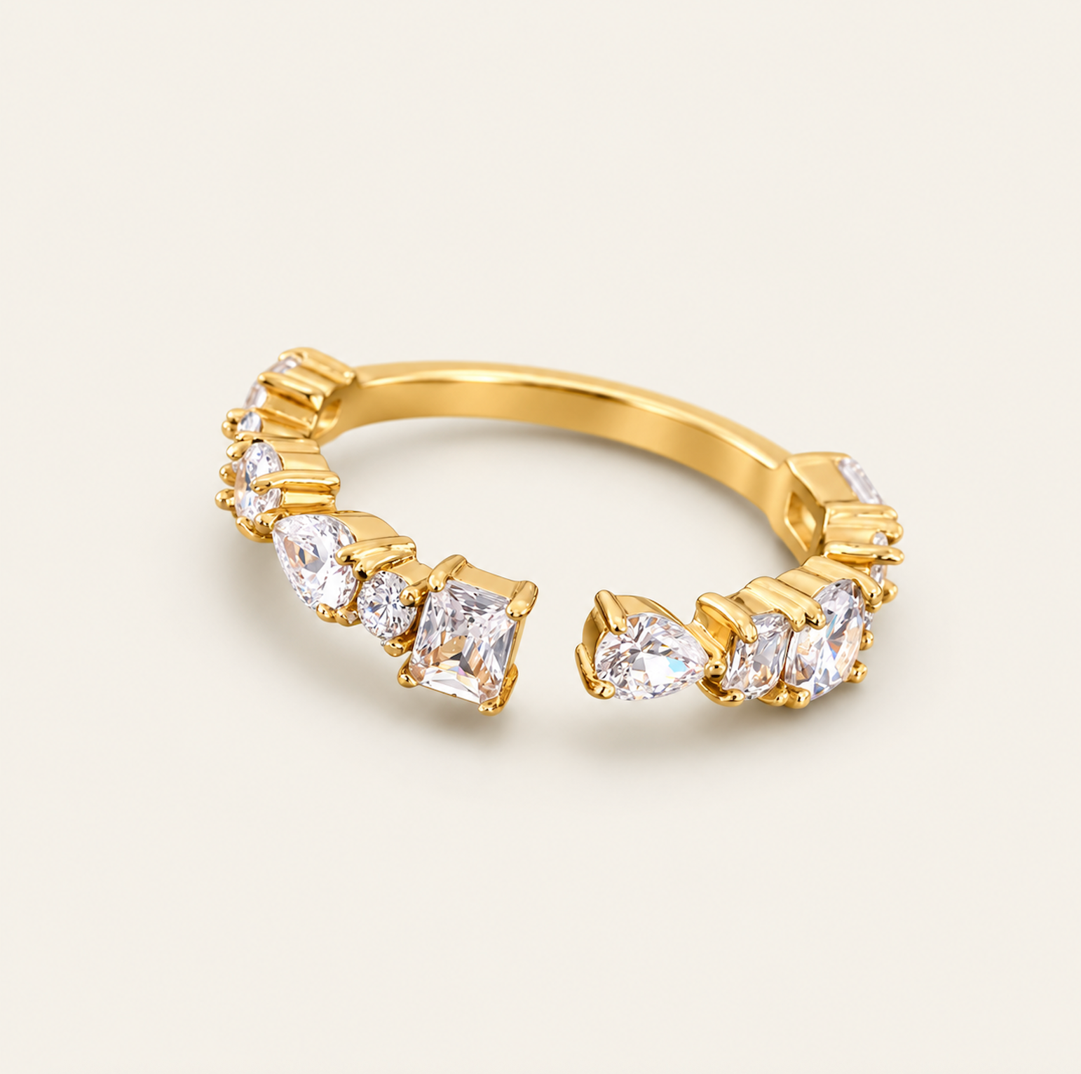 Elara Adjustable Radiance Ring in 18K PVD gold with sparkling 5A cubic zirconia stones in mixed cuts, adjustable from sizes 6–11.